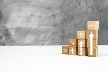 Fototapeta premium Wooden Blocks Showing Percentage Increase on White Surface.