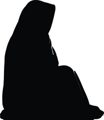 Black silhouette of a woman wearing a hijab or headscarf sitting on the ground in a contemplative pose