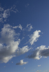 It's a sky with fluffy clouds and sunlight.