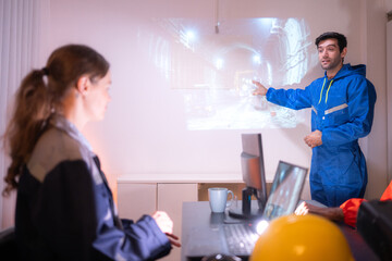 Obraz premium Engineers and industrial workers in safety uniforms discussing a tunnel construction project
