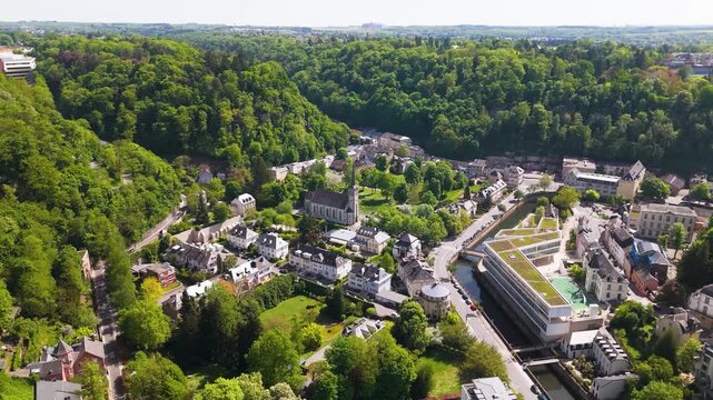 beautiful homes valley city river flowing through green hills surrounding luxembourg to left right panning residential area urban landscape scenic views cityscape 