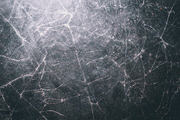 The glass surface is cracked with a complex random crack pattern. The texture of the broken glass is clearly visible with detailed fine crack lines spreading across the surface.