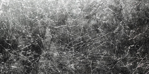 The glass surface is cracked with a complex random crack pattern. The texture of the broken glass is clearly visible with detailed fine crack lines spreading across the surface.