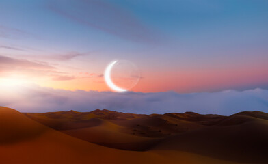 Night sky with crescent moon in the clouds on the foreground hot desert (sand dune) 