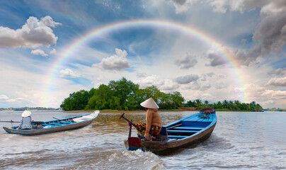 Fisherman is fishing in Mekong river in the morning - People boating in the delta of Mekong river,...