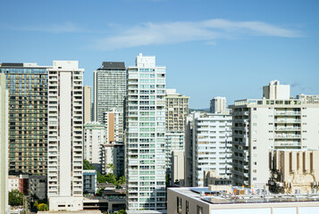 Fototapeta premium Modern residential high-rises in a sunny city under blue sky