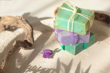 Cubes of natural soap against backdrop of natural elements. Handicrafts and hobbies. Cosmetics and beauty. Eco-friendly products. Background, composition for design.