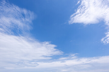 Fototapeta premium clear blue sky background,clouds with background, Blue sky background with tiny clouds. White fluffy clouds in the blue sky. 