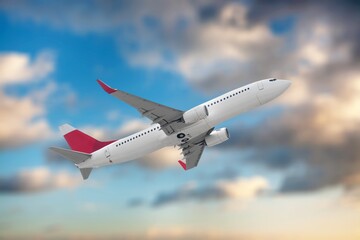 Flying airplane in blue sky, travel background