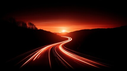Fototapeta premium A highway illuminated by light trails from passing cars during a stunning sunset or sunrise,