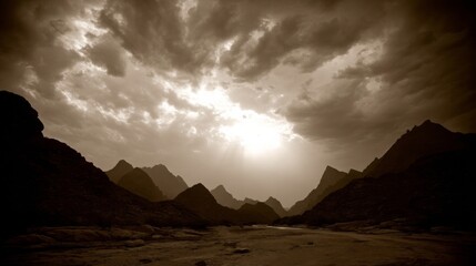 Sepia-toned mountainous landscape during sunrise or sunset with prominent cloud formations, sunlight beams,