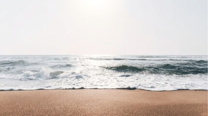 A vast body of water with gently breaking waves near the shore, wide expanse of light brown sandy shores,