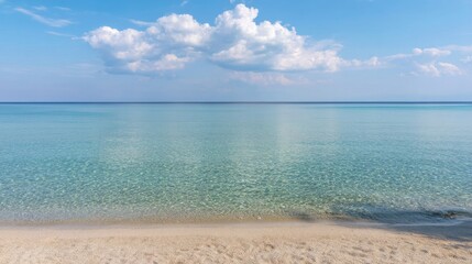 Tranquil seascape with clear shallow water revealing sandy ocean floor,