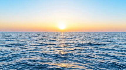 Obraz premium Calm sea with gentle waves reflecting sunset colors, creating serene atmosphere