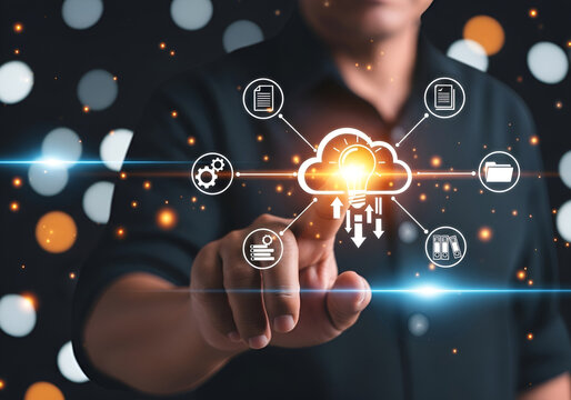Businessman interacting with cloud computing and digital technology interface icons