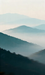Obraz premium Peaceful morning vista of foggy mountain silhouettes stretching into the horizon