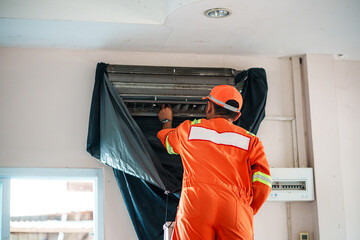 Air conditioning maintenance work office setting action photography indoor environment close-up viewpoint technical service