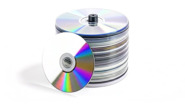 Detailed view of a tall stack of reflective optical discs, one colorful disc at front