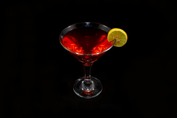 A juice glass isolated on black background closeup view with copy space 