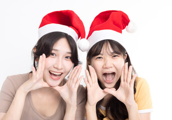 Girls in Santa's caps having fun