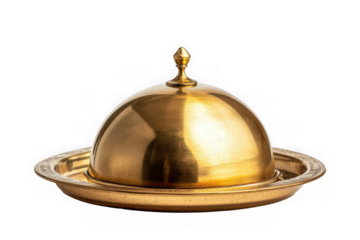 Golden serving cloche raised above empty golden plate on black background dome