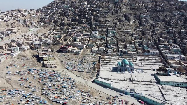 Kabul, Afghanistan. Drone Shot of Sakhi Shrine Blue Mosque, Cemetery and Hillside Homes