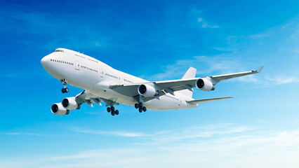 Obraz premium White airplane corner view low angle flying in the blue sky background. Modern passenger jet airplane.