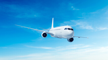 Obraz premium White airplane front view flying in the blue sky background. Modern passenger jet airplane.