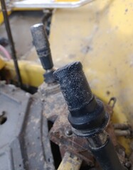 Close-up of dirty tractor control levers