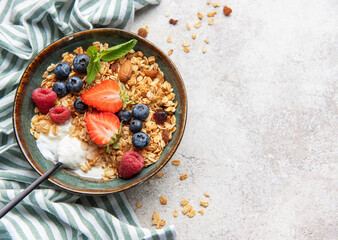 Granola bowl with fresh berries for healthy breakfast