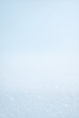 Obraz premium Soft blue winter background with falling snow — minimal seasonal texture