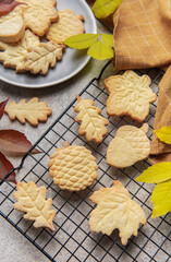 Homemade autumn cookies baking on cooling rack