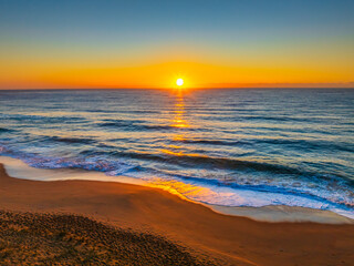 Sunrise at the Seaside with Clear Blue Skies