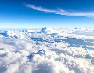 Aerial perspective showing fluffy white clouds against a bright blue sky with wispy formations