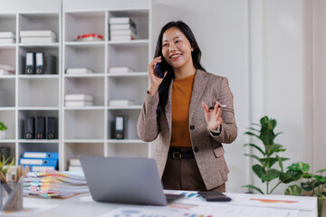 Office, business asian woman and laptop with phone call for communication, financial help or bank...