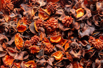 Potpourri or Pot Pourri, orange autumn fall colours with an orange and cinnamon scent. Natural aromatherapy scented concept.