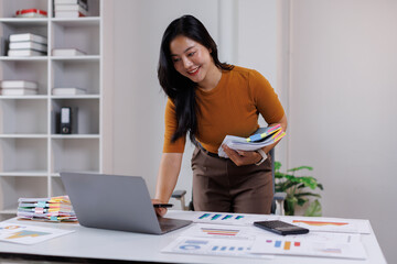 Business woman hands of paper files for searching and checking on laptop unfinished document archives on folders papers at busy work desk office