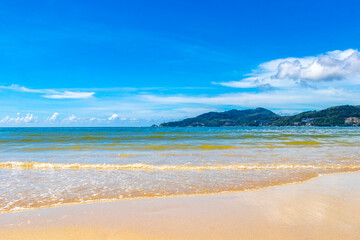 Patong Beach Phuket with turquoise blue water white sand Thailand.