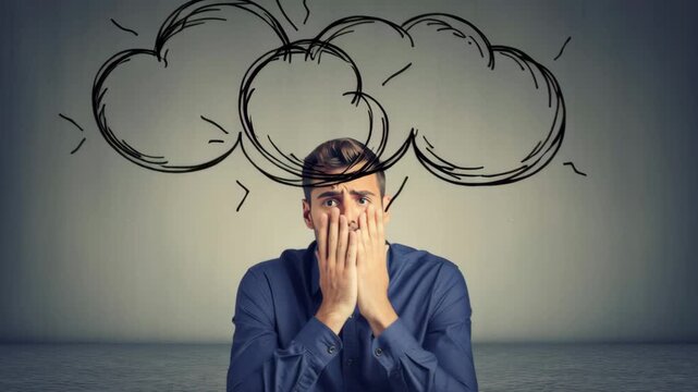Young man expressing frustration with hands on face and thought cloud illustrated above head