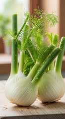 Fresh fennel bulbs on a wooden table.
