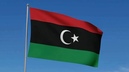 Libya national flag waving under blue sky