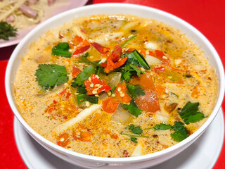 Bowl of Spicy and Savory Thai Tom Yum Goong Soup
