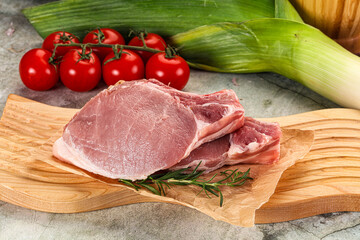 Raw pork steak loin with bone
