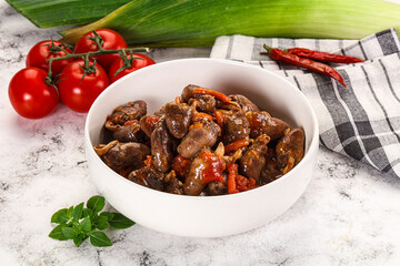 Baked chicken hearts with vegetables