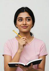 Indian college student holding books and smiling isolated on plain background