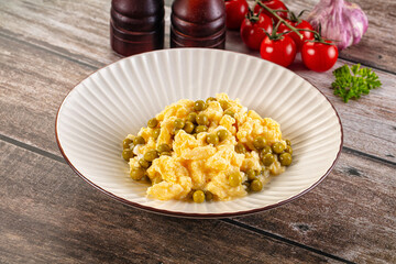Scrambled egg omelet with green peas