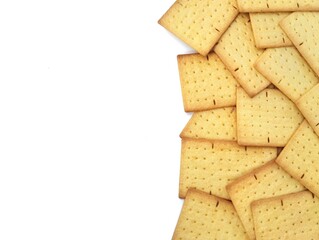 Pile of square biscuits cracker isolated on white background. Copy space 