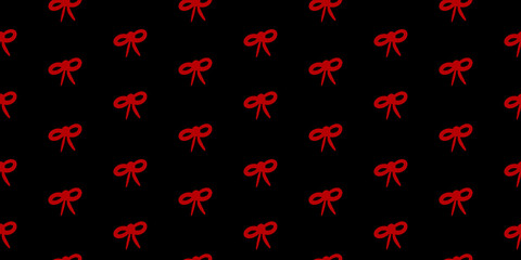 Festive seamless pattern featuring red bows on a dark background for Christmas fabric design