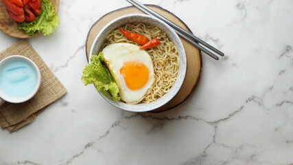 a bowl of noodle isolated on white background. Selective focus. Instant noodles that will increase in price