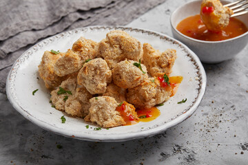 Breaded cauliflower with orange sauce